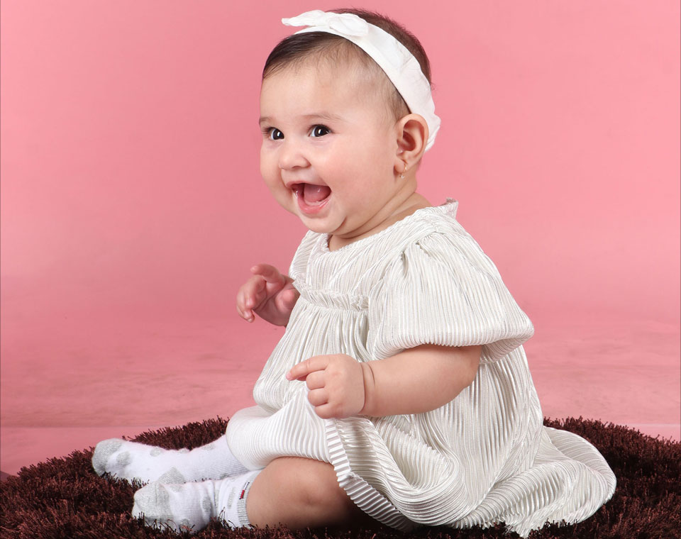 Sarrah Maqbool baby photoshoot formal silver white dress image